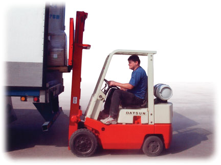 Forklift loading a truck